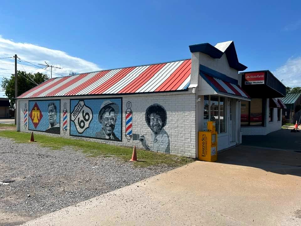Doc's Barber Shop on the corner, mural and striped roof along the street